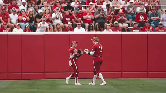Abby Dayton and Kasidi Pickering in the outfield during Super Regionals