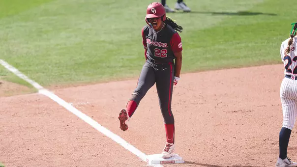 Kai Minor celebrating a triple against Auburn