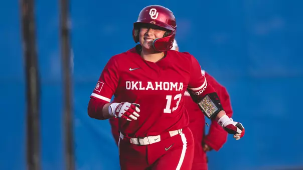 Isabela Emerling rounding third base after hitting a home run against Memphis