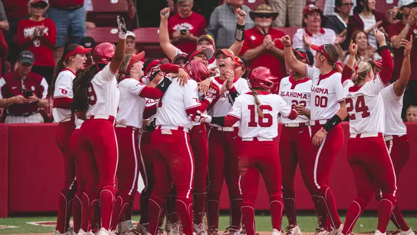 Kendall Wells touches home plate for the record-setting home run