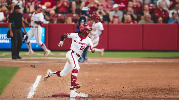 Kai Minor rounding first base in the game against Kentucky