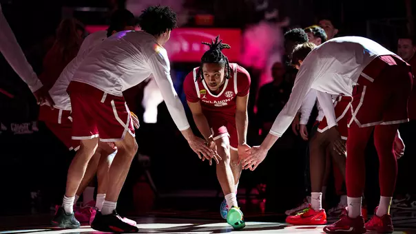 Nijel Pack runs through teammates lined up on either side of the bench during team introductions at the College Basketball Crown tournament at T-Mobile Arena in Las Vegas, Nevada