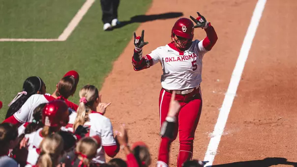 Ella Parker running home after hitting a home run against Kentucky