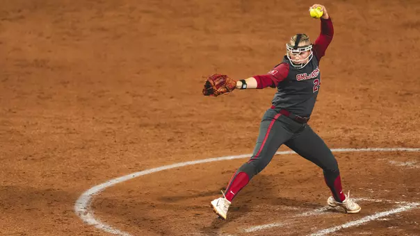 Picture of Audrey Lowry pitching against Texas A&M on the night of the first game in the series