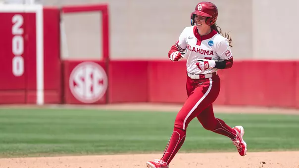Kasidi Pickering rounds the bases after hitting a home run against Binghamton
