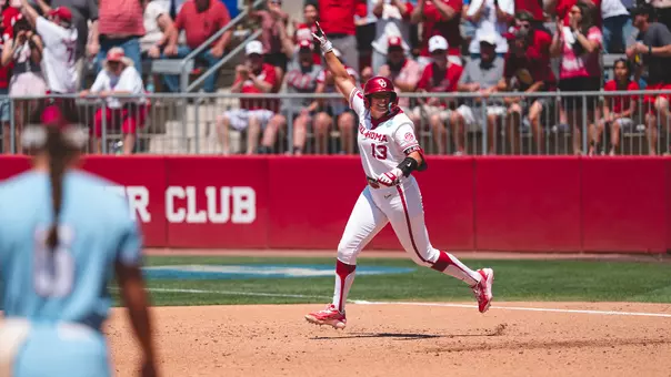 Isabela Emerling rounds first base after hitting a home run against Kansas