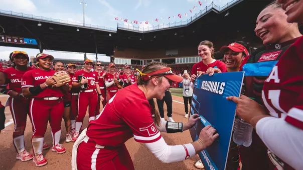 Abby Dayton puts the OU sticker on the regional ticket after defeating Michigan