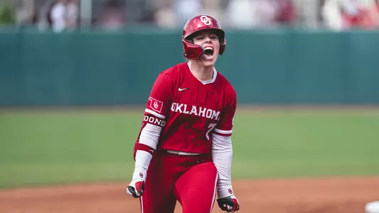 Kasidi Pickering celebrates a three-run home run to right center