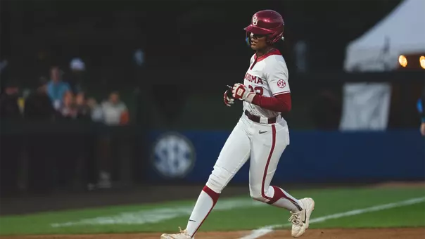 Kai Minor rounding third base after hitting a home run