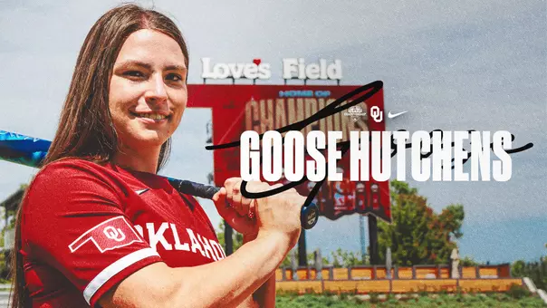 Picture of Juliana "Goose" Hutchens at Love's Field with a bat on her shoulder
