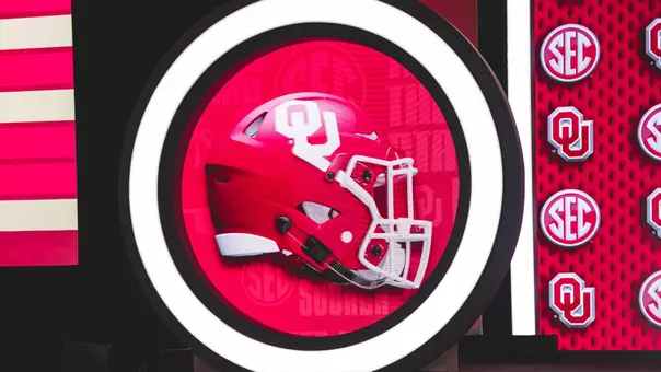 Photo of video screen with OU helmet at 2026 SEC Football Media Days
