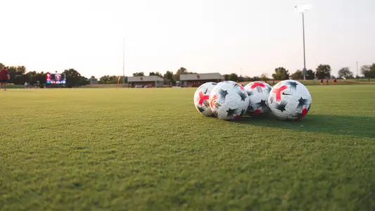 picture of OU soccer balls on John Crain Field before a game