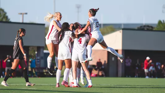 Picture of OU Soccer celebrating after a goal against Northwestern State