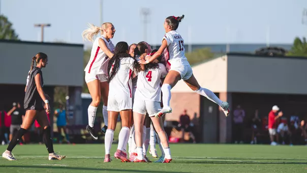 OU Soccer celebrating after a goal against Northwestern State