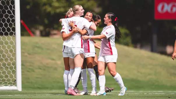 Emily Davey celebrates with the team during a 6-0 win against Colorado College