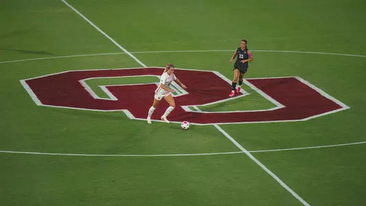 Ally Laccinole dribbles the ball up field