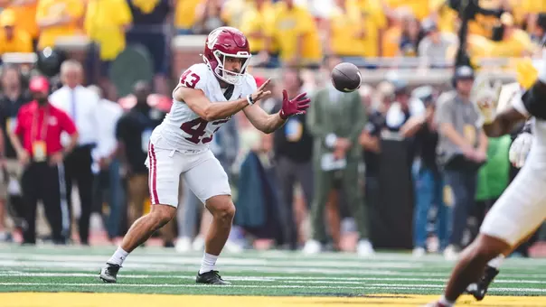 Grayson Miller punts in Oklahoma's game at Michigan on Sept. 12, 2026