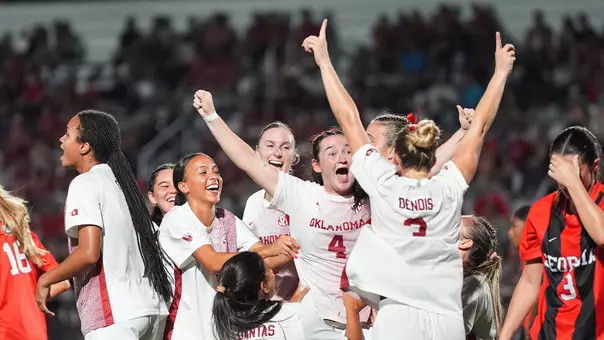 Sophie Morrin and the Sooners celebrate a goal in the 3-1 win against Georgia