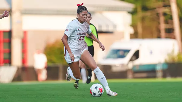 Kate McCallister dribbles the ball up the field against Georgia