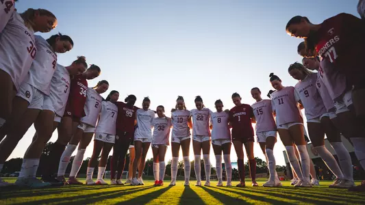 Picture of a team huddle during the game against LSU