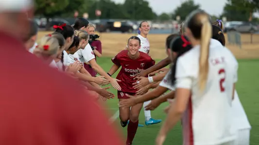 Picture of Callie Sullivan in a pre-game high five tunnel