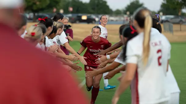 Picture of Callie Sullivan in a pre-game high five tunnel