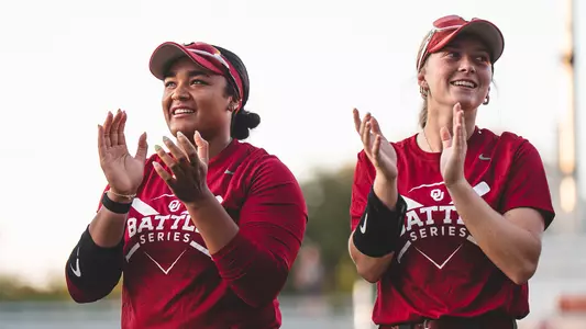 Picture of Chaney Helton and Ella Parker clapping during pre-game of a Battle Series game
