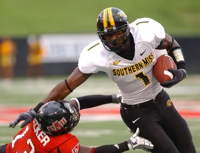 Southern Mississippi's Shawn Nelson, right, tries to avoid a tackle from Arkansas States Daylan Walker during the first half of an NCAA college football game at Jonesboro, Ark., on Saturday, Sept. 13, 2008. (AP Photo/The Jonesboro Sun, Saundra Sovick)