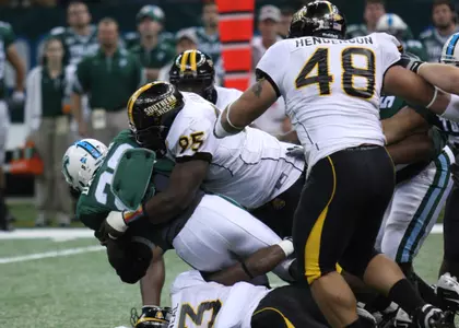 Anthony Gray puts a hit on the Tulane running back.