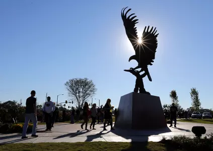 Football fans gather around Lofty Return, a statue dedicated this week on campus. Mandatory Credit: Chuck Cook-USA TODAY Sports
