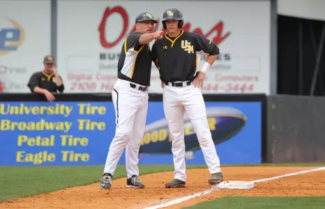 Scott Berry gives Bradley Roney instructions at third base.