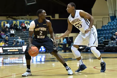 Guard Matt Bingaya (2) works against the Dragons during the second half.