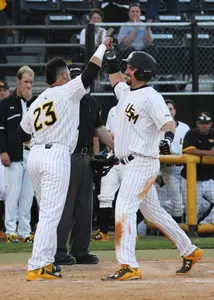 Tim Lynch (right) celebrates with Chase Scott after hitting his ninth home run of the year.