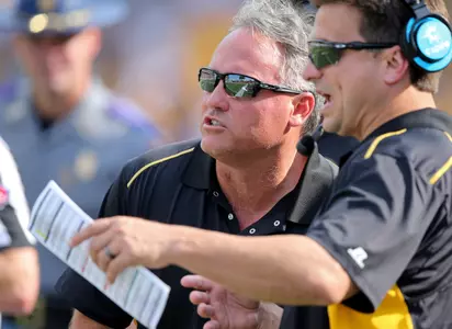Sep 2, 2017; Hattiesburg, MS, USA; Southern Miss Golden Eagles head coach Jay Hopson (center) talks to offensive coordinator Shannon Dawson in the second quarter against the Kentucky Wildcats at M. M. Roberts Stadium. Mandatory Credit: Chuck Cook-USA TODAY Sports