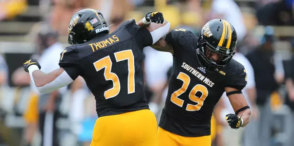 Southern Miss Linebacker Devin Thomas (37) and Southern Miss Defensive Back Camron Harrell (29) clelbrate a big stop against Tulane in an NCAA college football game in Hattiesburg, Miss., Saturday, Sept. 26, 2020. (Photo by Joe Harper/bgnphoto.com)