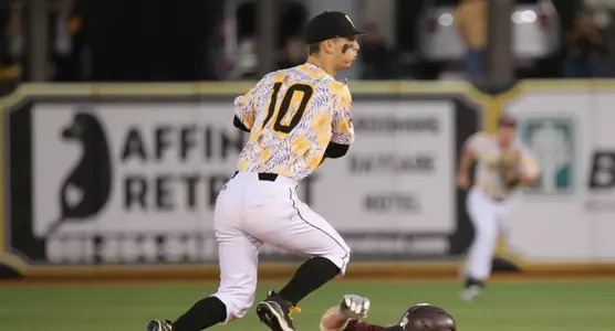 Baseball action vs Little Rock - Dustin Dickerson turns the double play as Houston Parker from Little Rock slides under him.