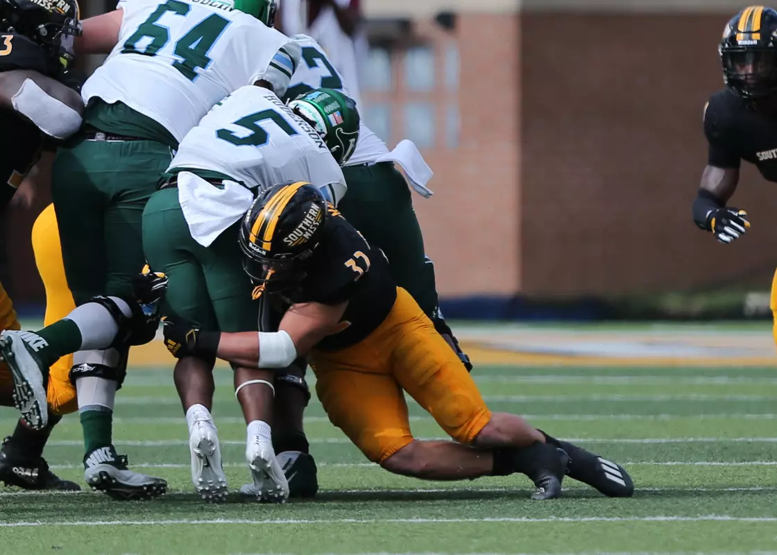 Southern Miss Linebacker Hayes Maples (32) brings down the Tulane runner against Tulane in an NCAA college football game in Hattiesburg, Miss., Saturday, Sept. 26, 2020. (Photo by Joe Harper/bgnphoto.com)
