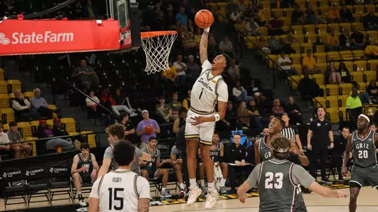 Southern Miss Golden Eagles guard Austin Crowley (1) coming in for a slam dunk in a game between the Southern Miss Golden Eagles and the Montana Grizzlies. November 29, 2022 (Joe Harper/bgnphoto.com)