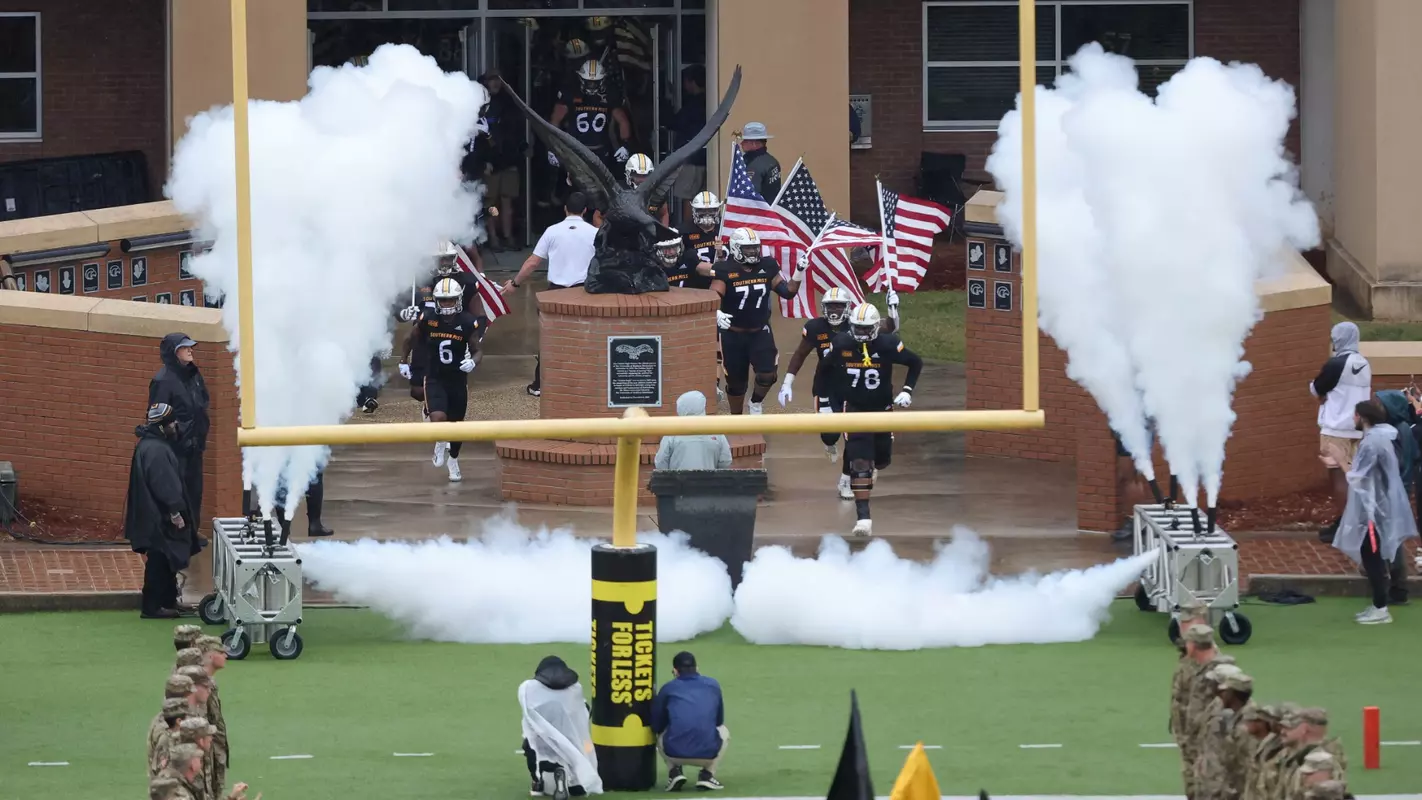 Southern Miss football team runs out onto the field on Military appreciation day in a game between the Southern Miss Golden Eagles and the Georgia State Panther. Saturday, November 4, 2022. (Joe Harper/bgnphoto.com)