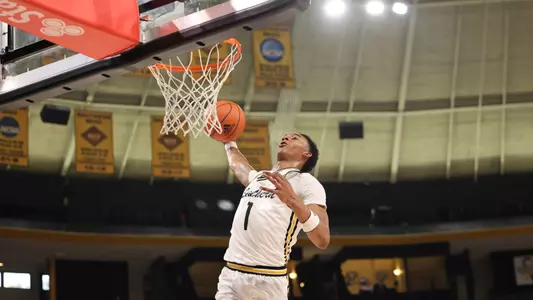 Southern Miss guard Austin Crowley (1) drives for a slam dunk one of 7 in the game in a game between the Southern Miss Golden Eagles and the Lamar Cardinals. December 10, 2022 (Joe Harper/bgnphoto.com)