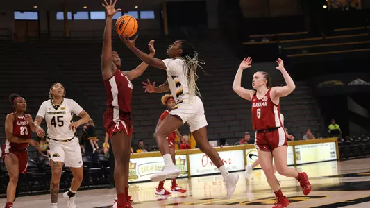 Southern Miss Lady Eagles guard Jacorriah Bracey (3) dives the lane for a lay up in a game between the Southern Miss Golden Eagles and the Alabama Crimson Tide. December 11, 2022 (Joe Harper/bgnphoto.com)