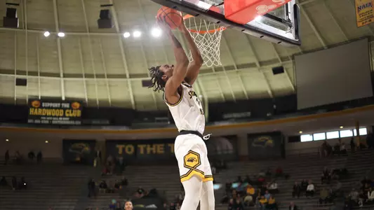 Southern Miss Golden Eagles forward Tyler Morman (0) with the bucket in a game between the Southern Miss Golden Eagles and the McNeese State Cowboys. December 18, 2022 (Joe Harper/bgnphoto.com)