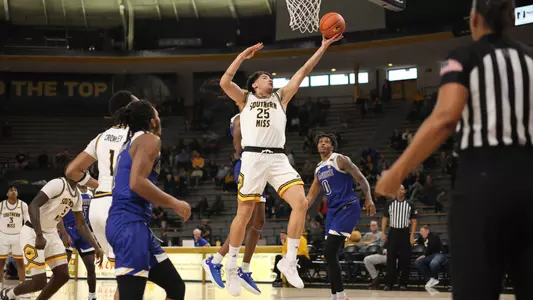 Southern Miss Golden Eagles guard Marcelo Perez (25)with a lay up in a game between the Southern Miss Golden Eagles and the McNeese State Cowboys. December 18, 2022 (Joe Harper/bgnphoto.com)