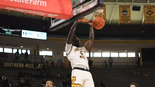 Southern Miss Golden Eagles forward DeAndre Pinckney (5) finished a slam dunk in a game between the Southern Miss Golden Eagles and the McNeese State Cowboys. December 18, 2022 (Joe Harper/bgnphoto.com)