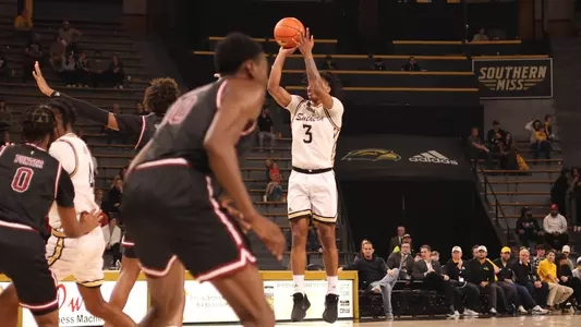 Southern Miss Golden Eagles guard Mo Arnold (3) takes a three point shot in a game between the Southern Miss Golden Eagles and the Troy Trojans. December 29, 2022 (Joe Harper/bgnphoto.com)