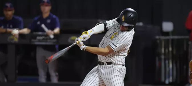 Southern Miss. infielder Danny Lynch (26) hits a walk off home run to win the game in the bottom of the 9th inning in a game against FAU . Friday March 18, 2022 (Photo by Joe Harper/BigGold Photography)