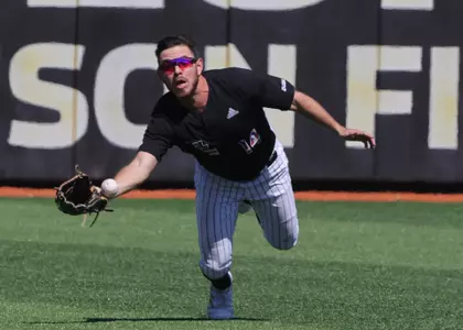 Southern Miss. outfielder Gabriel Montenegro (14) makes a diving attempt at a fly ball in a game against FAU. Saturday March 19, 2022  (Photo by Joe Harper/BigGold Photography)
