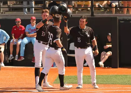 Southern Miss. outfielder Reece Ewing (38) is welcomed home by Southern Miss. catcher Rodrigo Montenegro (15) and Southern Miss. outfielder Carson Paetow (37) in a game against La Tech. Sunday April 3, 2022 (Photo by Joe Harper/BigGold Photography)