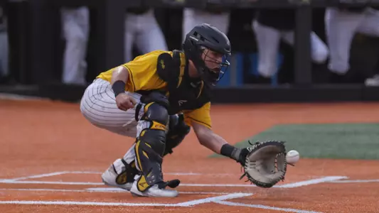 Southern Miss. catcher Rodrigo Montenegro (15) catches the ball at home thrown by Southern Miss. first baseman Christopher Sargent (41)in a game against the Ole Miss Rebels. Wednesday May 11, 2022 (Photo by Joe Harper/BigGold Photography)