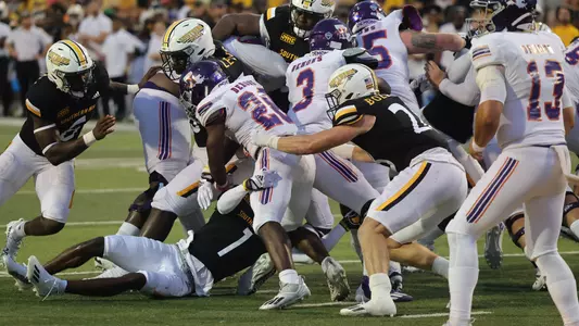 Southern Miss Golden Eagles safety Lakevias Daniel (1) and Southern Miss Golden Eagles linebacker Swayze Bozeman (28) make a tackle on Northwestern State Demons running back Kennieth Lacy (28) in a game between the Southern Miss Golden Eagles and the Northwestern State. Saturday, September 17, 2022 (Photo by Joe Harper/BigGold Photinography)